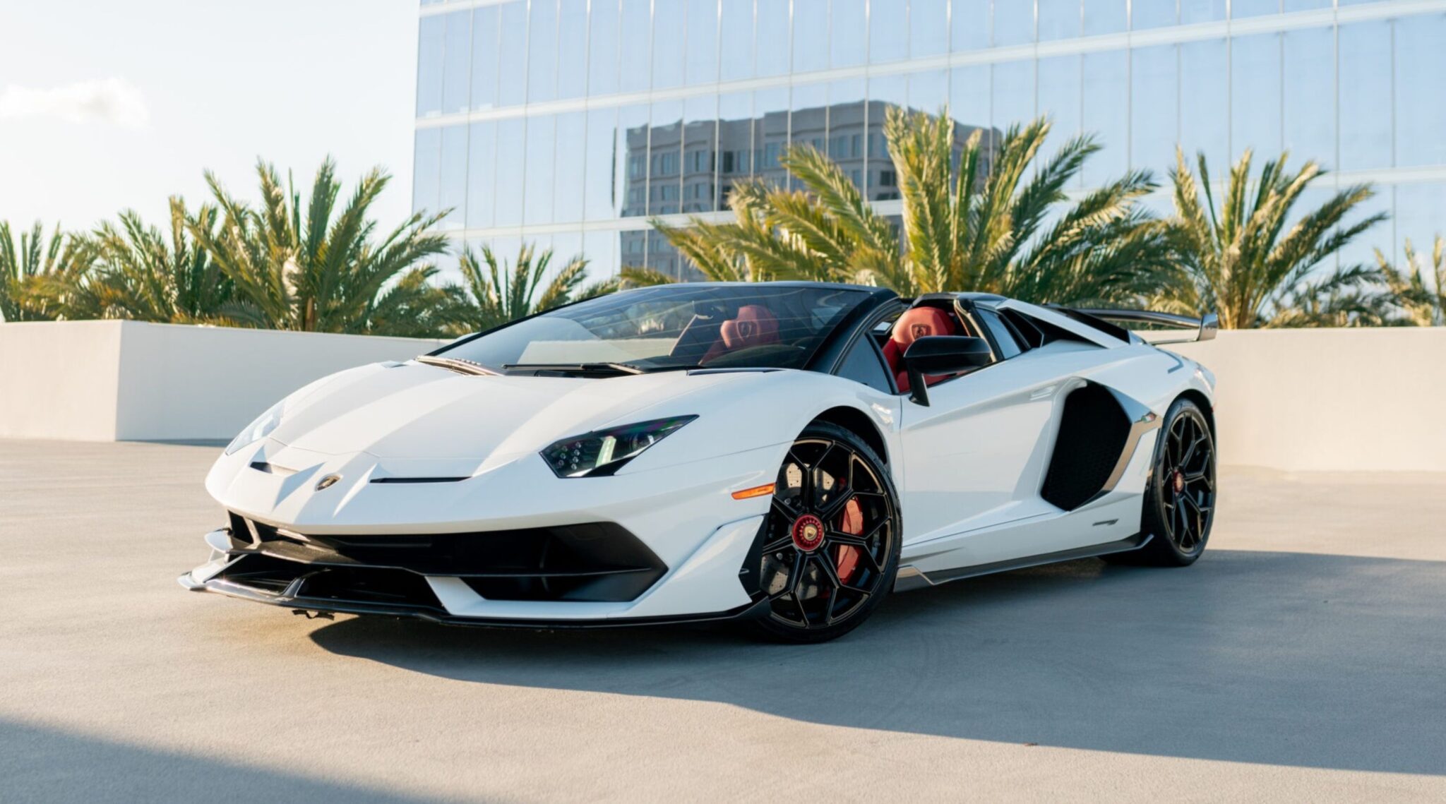 White Lamborghini Aventador SVJ Roadster hypercar for rent in Orange County