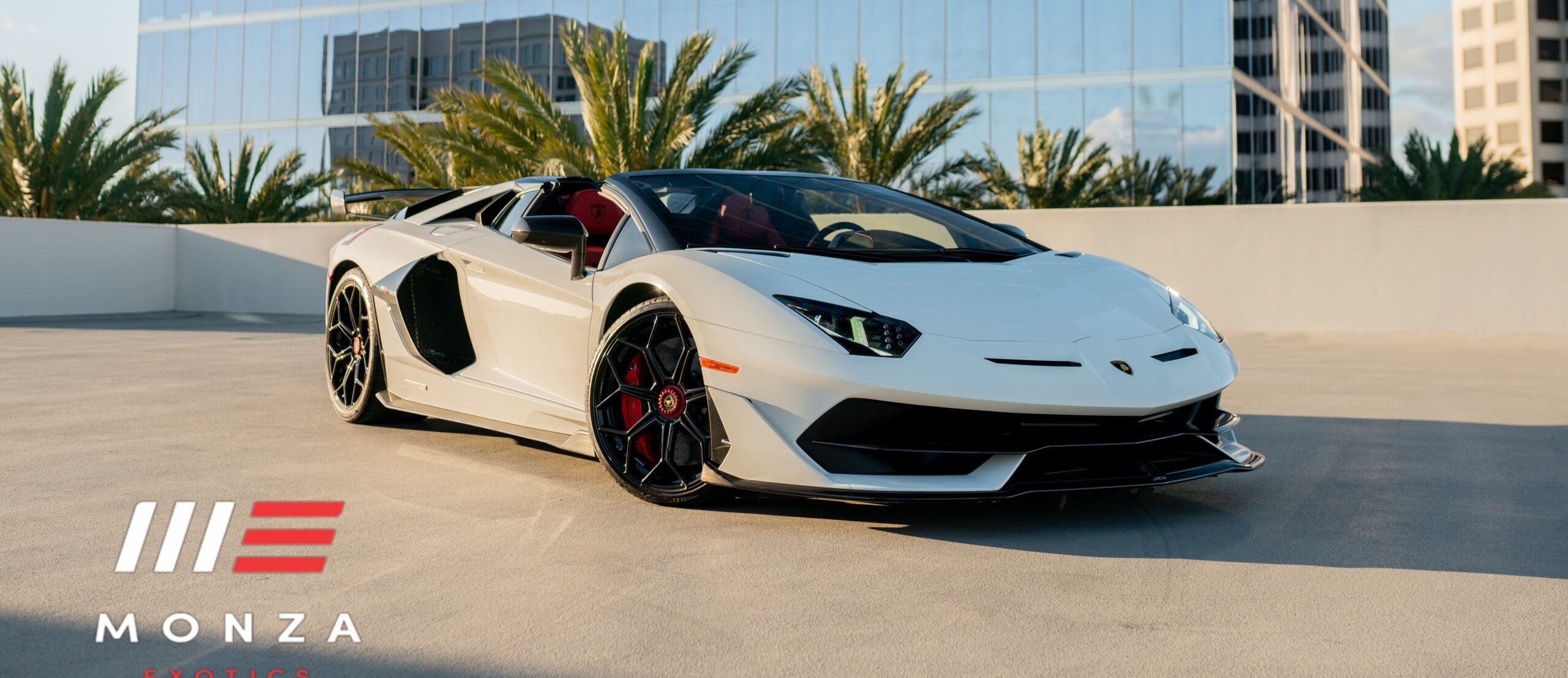 White Lamborghini Aventador SVJ Roadster AWD hypercar with Red and Orange interior