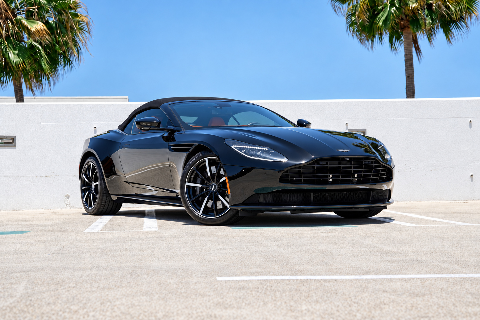 Black Aston Martin DB11, front three-quarter view, a 503 hp twin-turbo V8 convertible to rent in Southern California