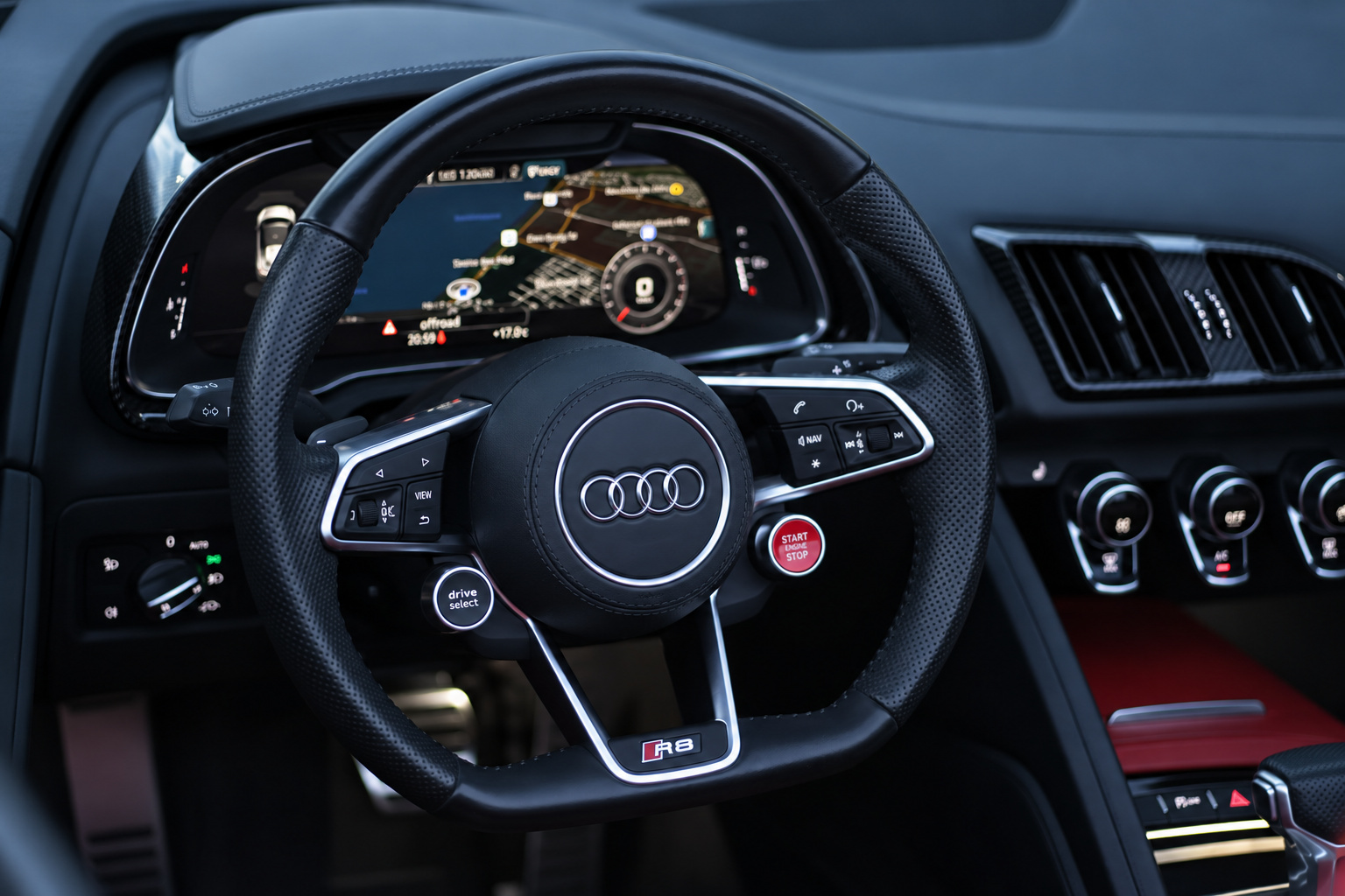 R8 V10 Spyder steering wheel with the red start button and the Virtual Cockpit display behind it
