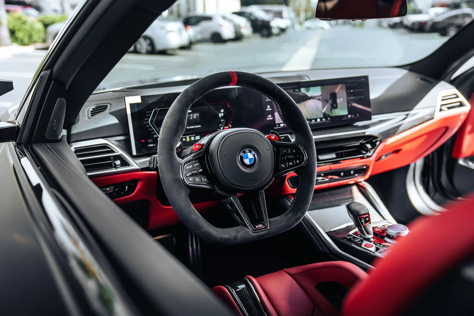 M4 Competition cabin, Alcantara steering wheel with a red marker, red leather and the carbon bucket seats