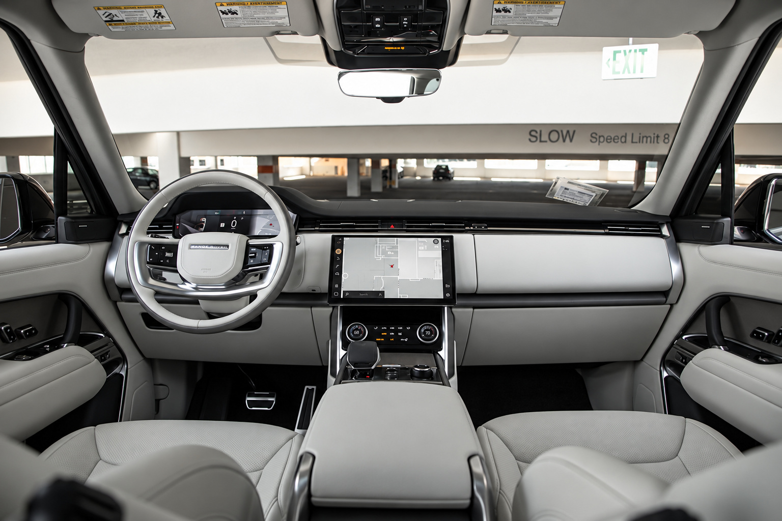 Full dash of the Range Rover HSE, ivory steering wheel, two-tone grey and ivory dash and the floating screen