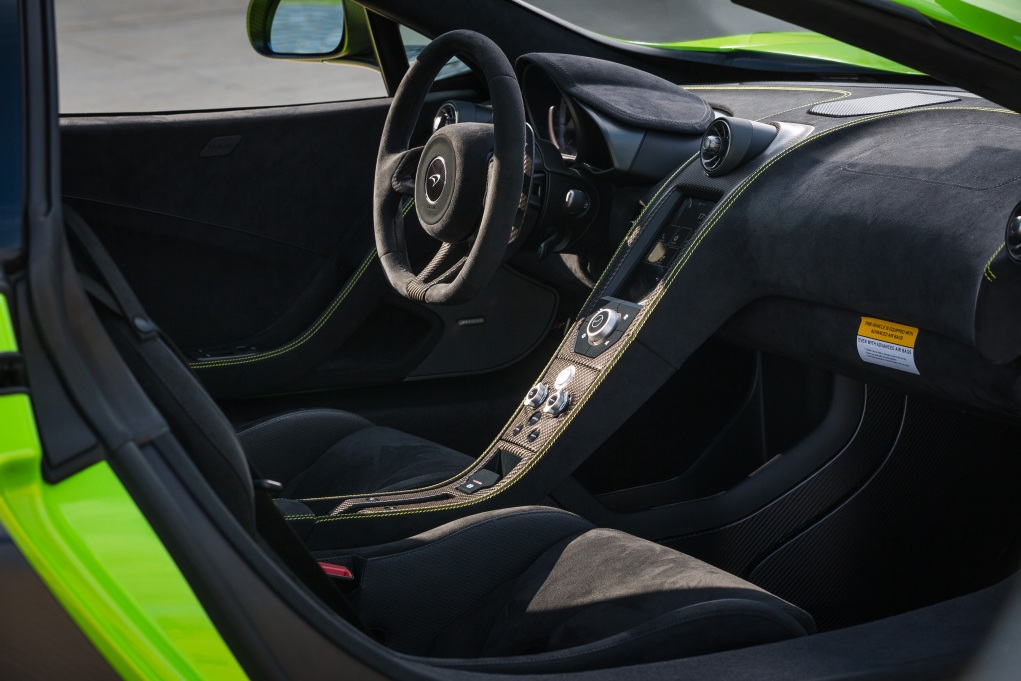 Black Alcantara cabin of the McLaren 675LT, Alcantara steering wheel and carbon bucket seats