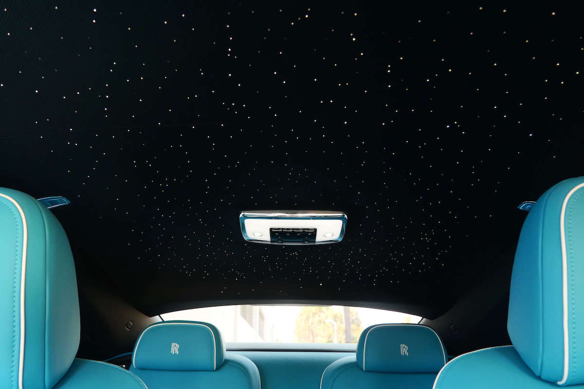 Starlight headliner in the white Spectre above turquoise seats with embroidered RR headrests