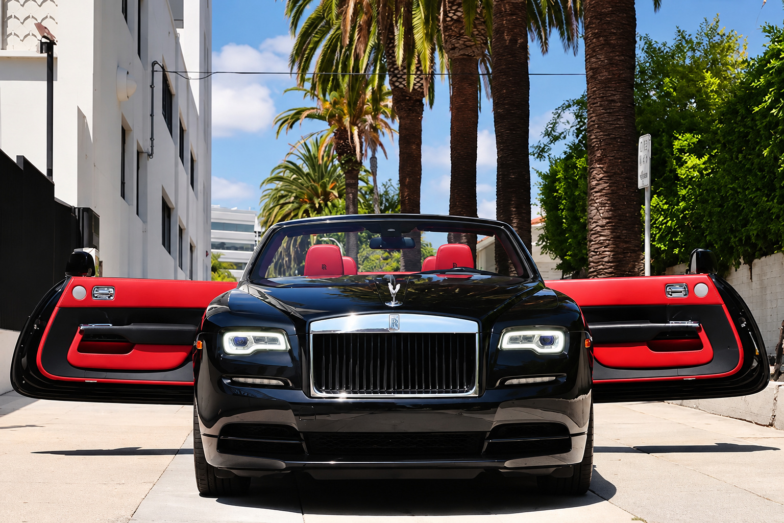 Black Dawn head-on with both coach doors open, red door panels and red seats under Los Angeles palms