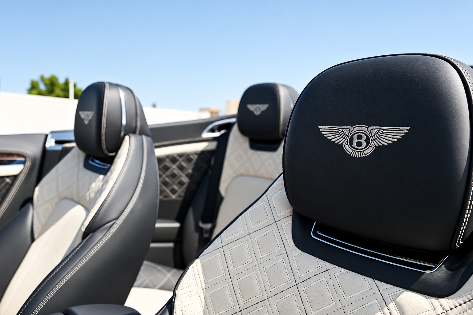 Close-up of the Bentley wings embroidered in the black headrest of the Continental GTC First Edition