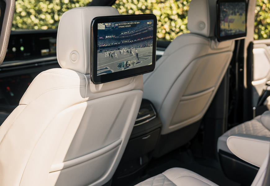 Ivory leather second row of the Escalade-V with the dual rear seat screens switched on