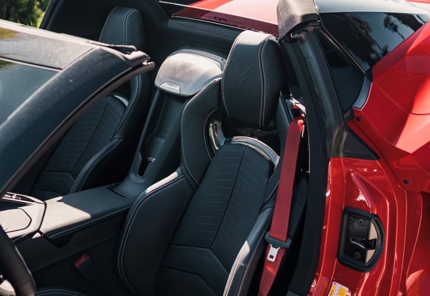 Black leather seats of the Corvette C8 Stingray seen from above with the roof panel removed