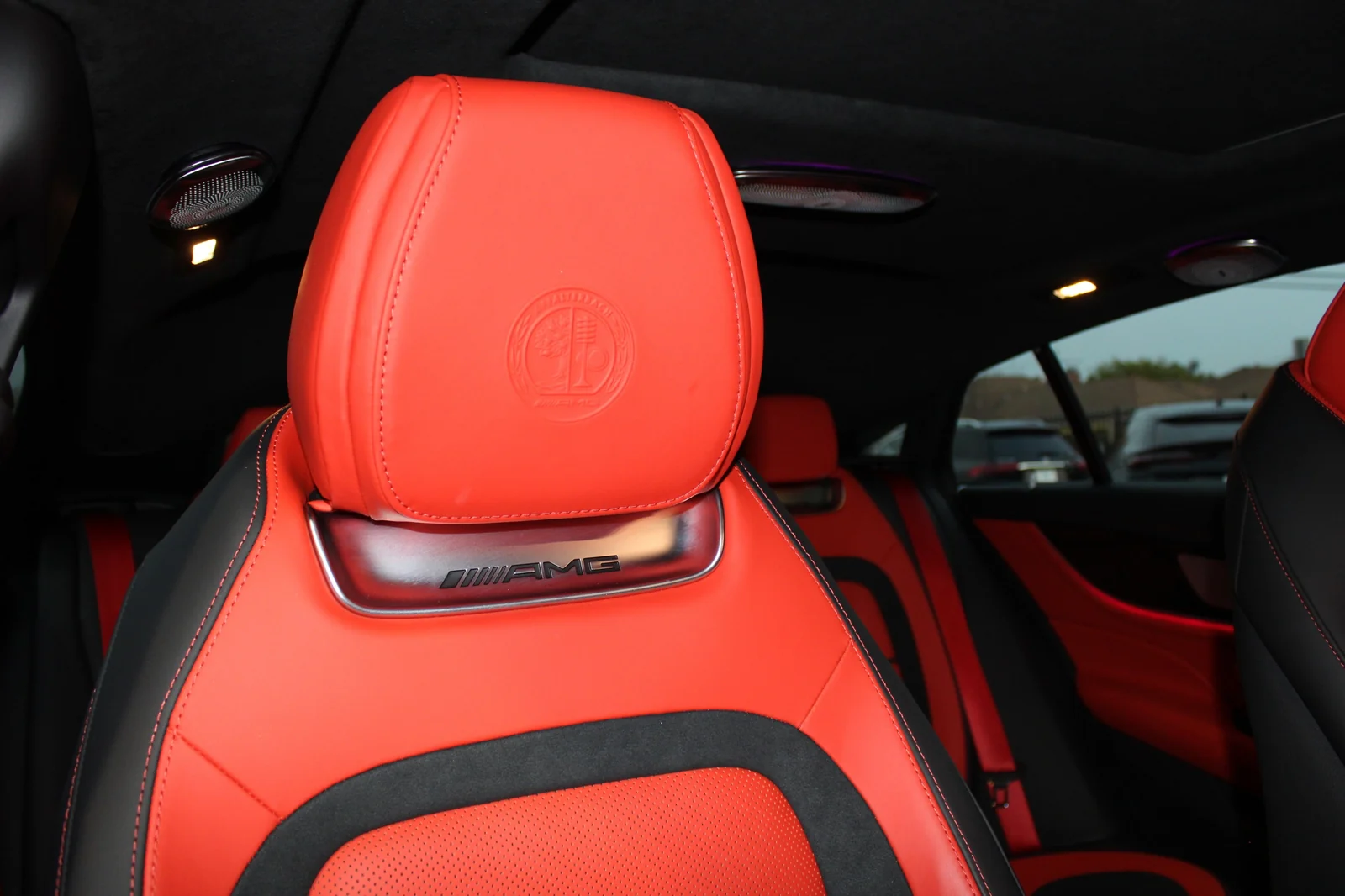 Red leather AMG performance seat in the GT 63 with the AMG emblem embossed below the head restraint