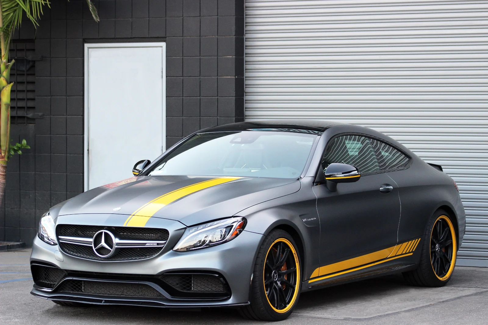 Grey Mercedes-Benz AMG C63, front view, a 503 hp twin-turbo V8 coupe to rent in Southern California