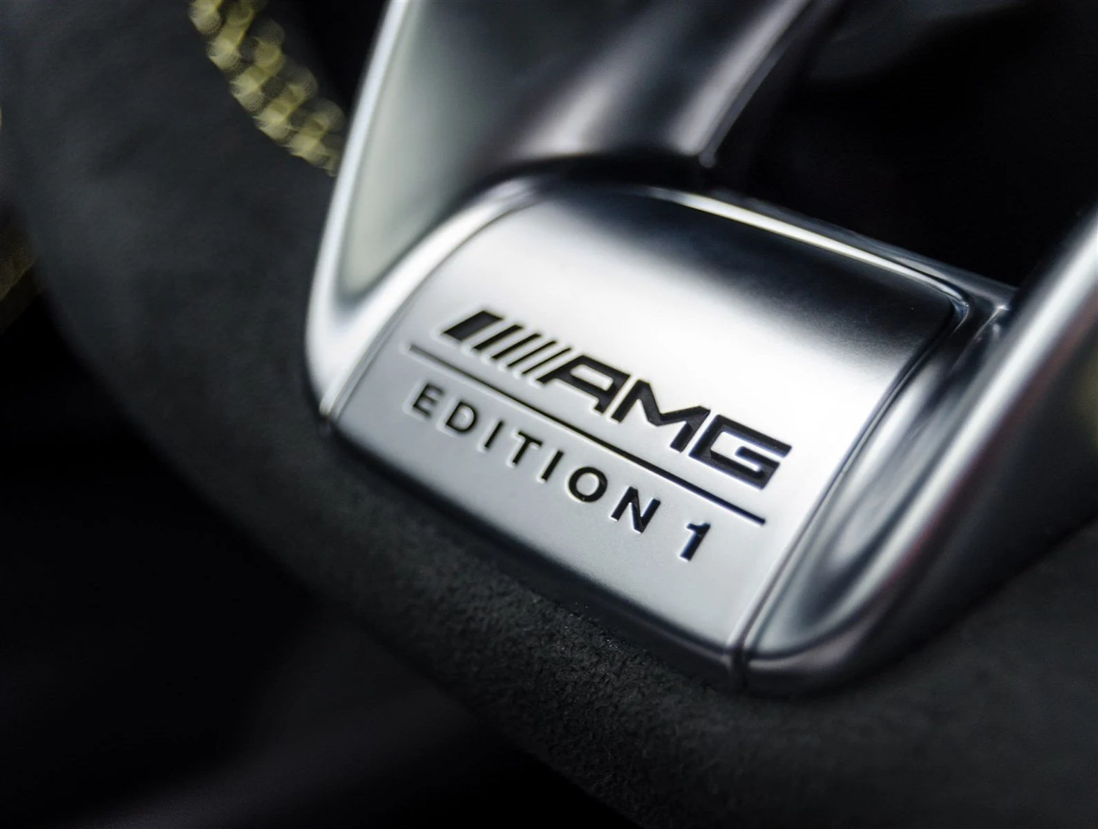 AMG Edition 1 badge stitched into the black Alcantara seat of the grey Mercedes-Benz AMG C63 rental