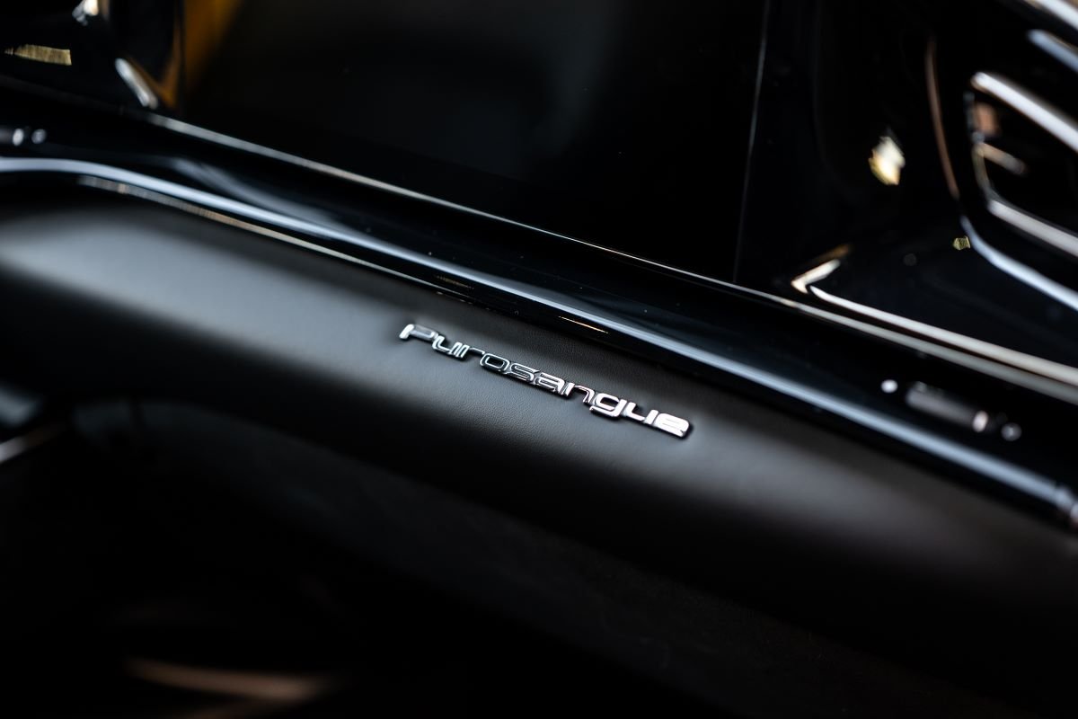Purosangue lettering on a dark trim strip inside the Ferrari in close up