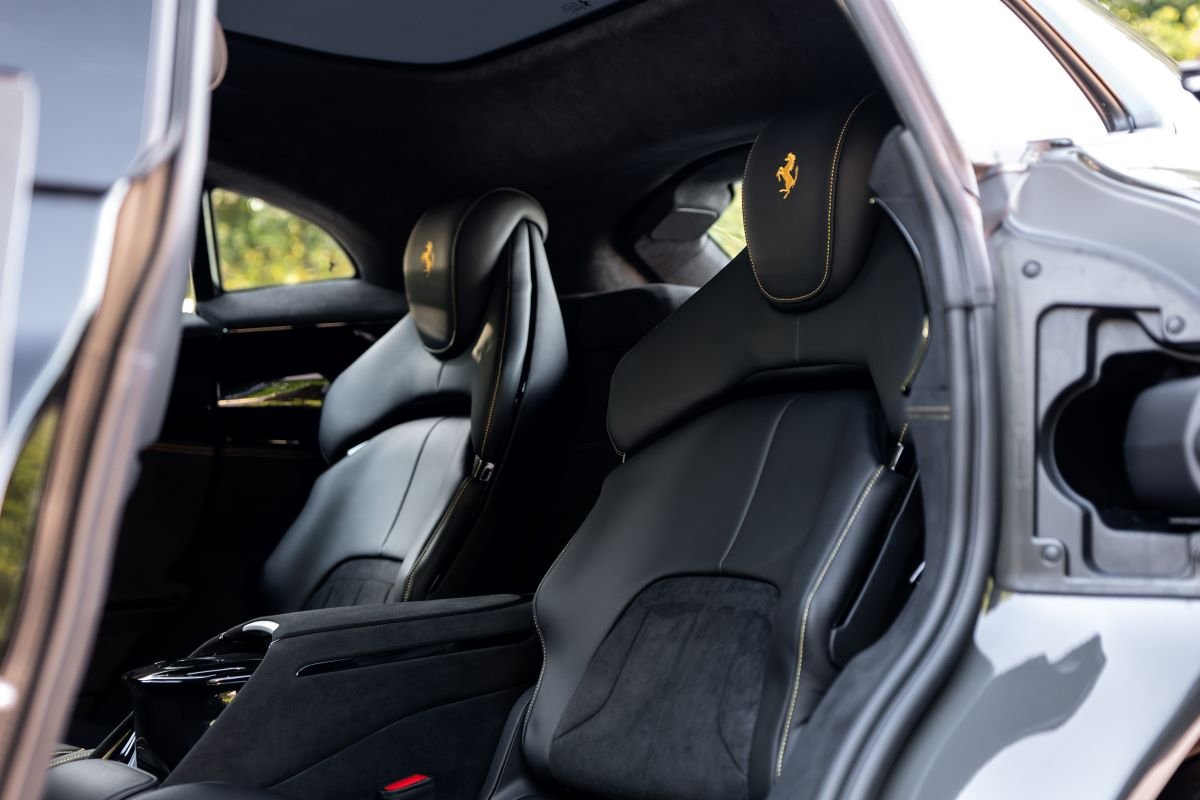 The 4 individual seats of the Ferrari Purosangue in black leather with yellow stitching and Cavallino headrests