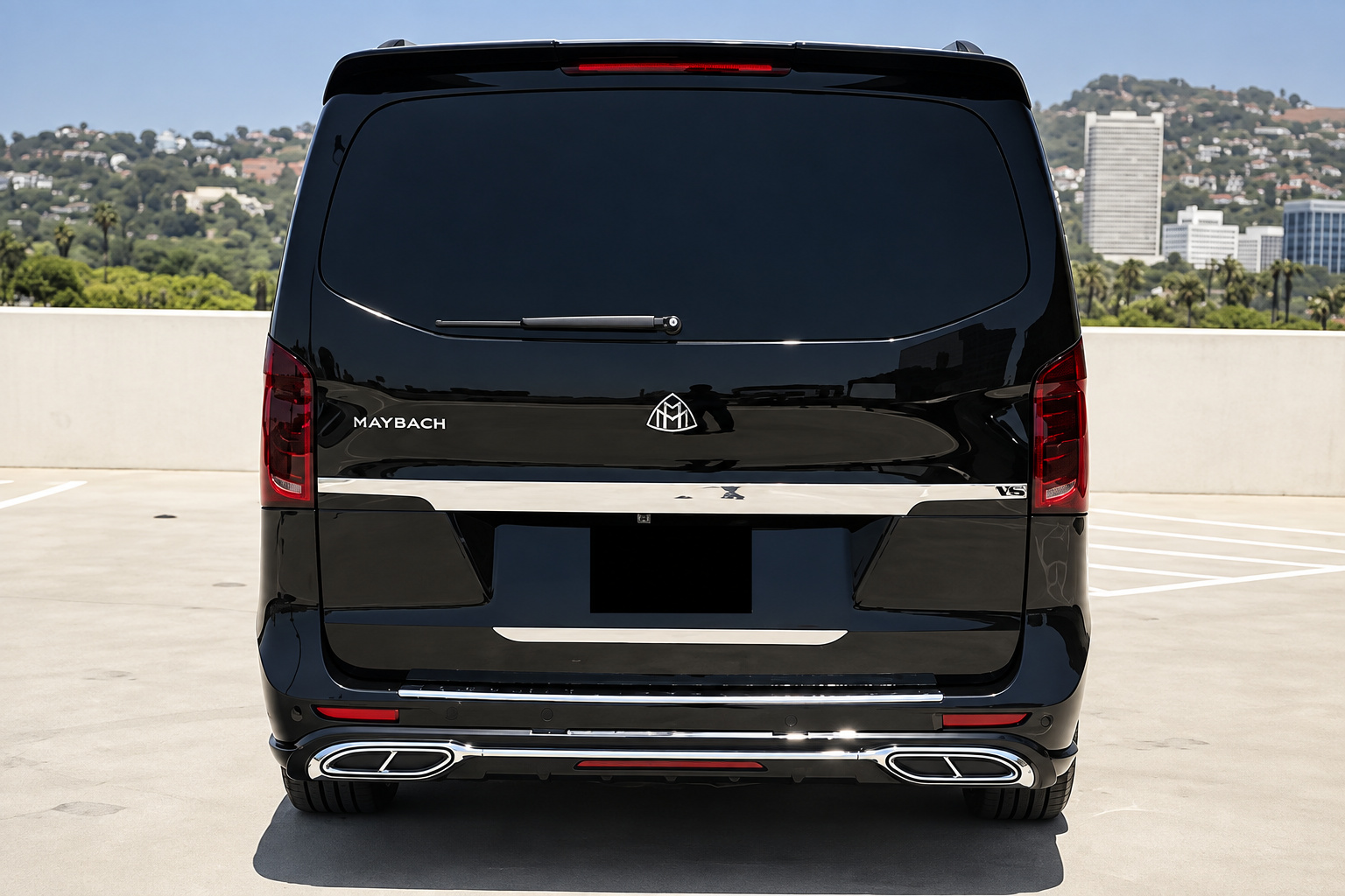 Rear view of the black Mercedes-Benz Sprinter rental with Maybach lettering across the tailgate