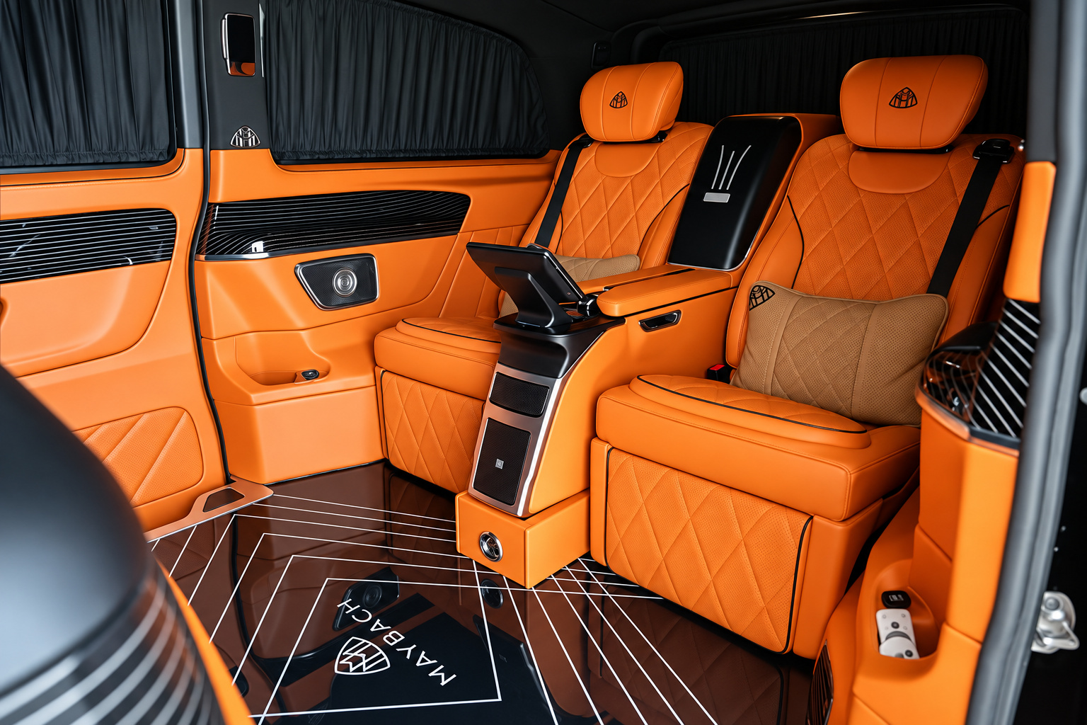 Rear cabin of the Mercedes-Benz Sprinter rental, orange diamond-quilted captain chairs over a star-lit floor