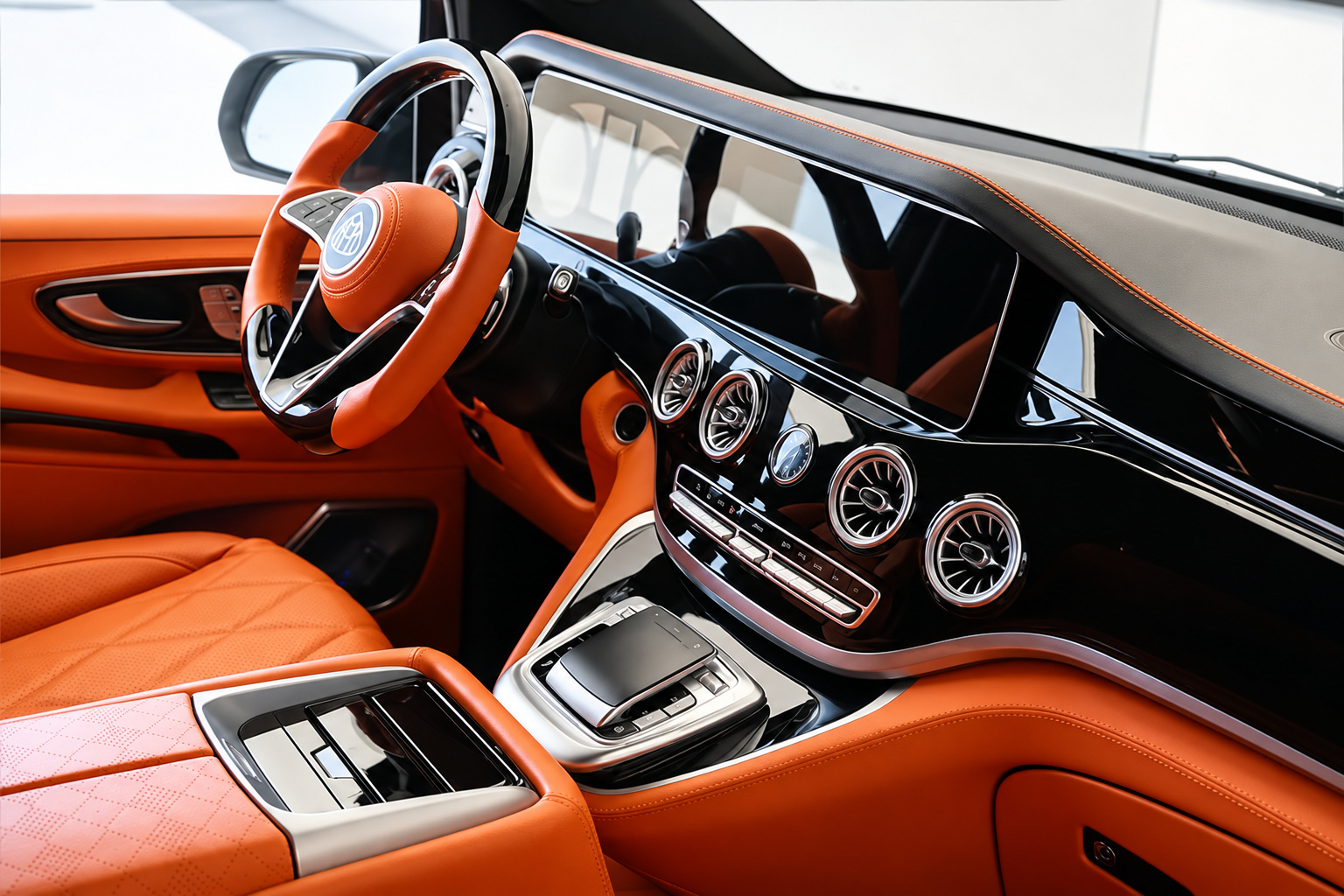 Dashboard of the Mercedes-Benz Sprinter rental in orange quilted leather with turbine vents