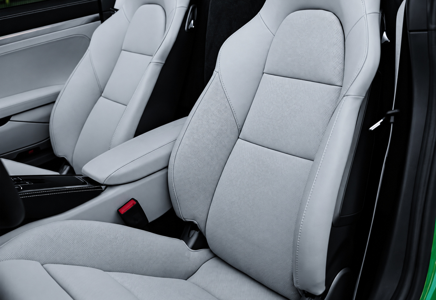 Light grey seats inside the Python Green Porsche 718 Boxster GTS 4.0 with black belts and trim