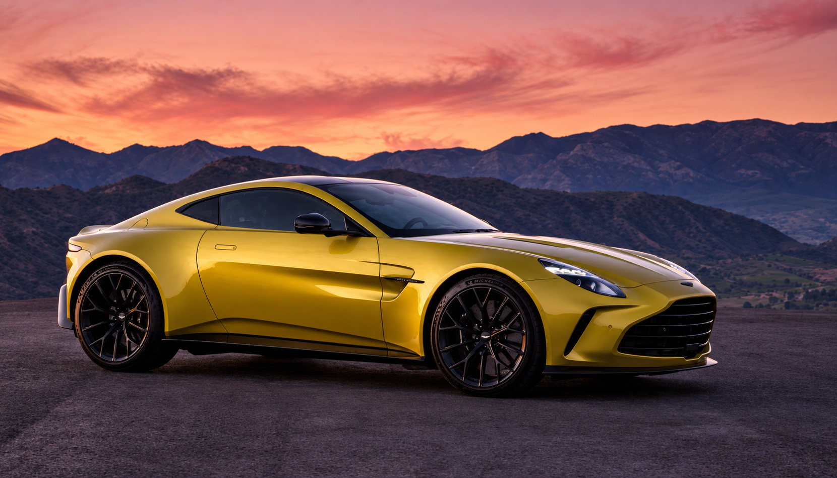 Yellow Aston Martin Vantage Roadster, a 2-seat convertible with a black leather interior, based in San Diego