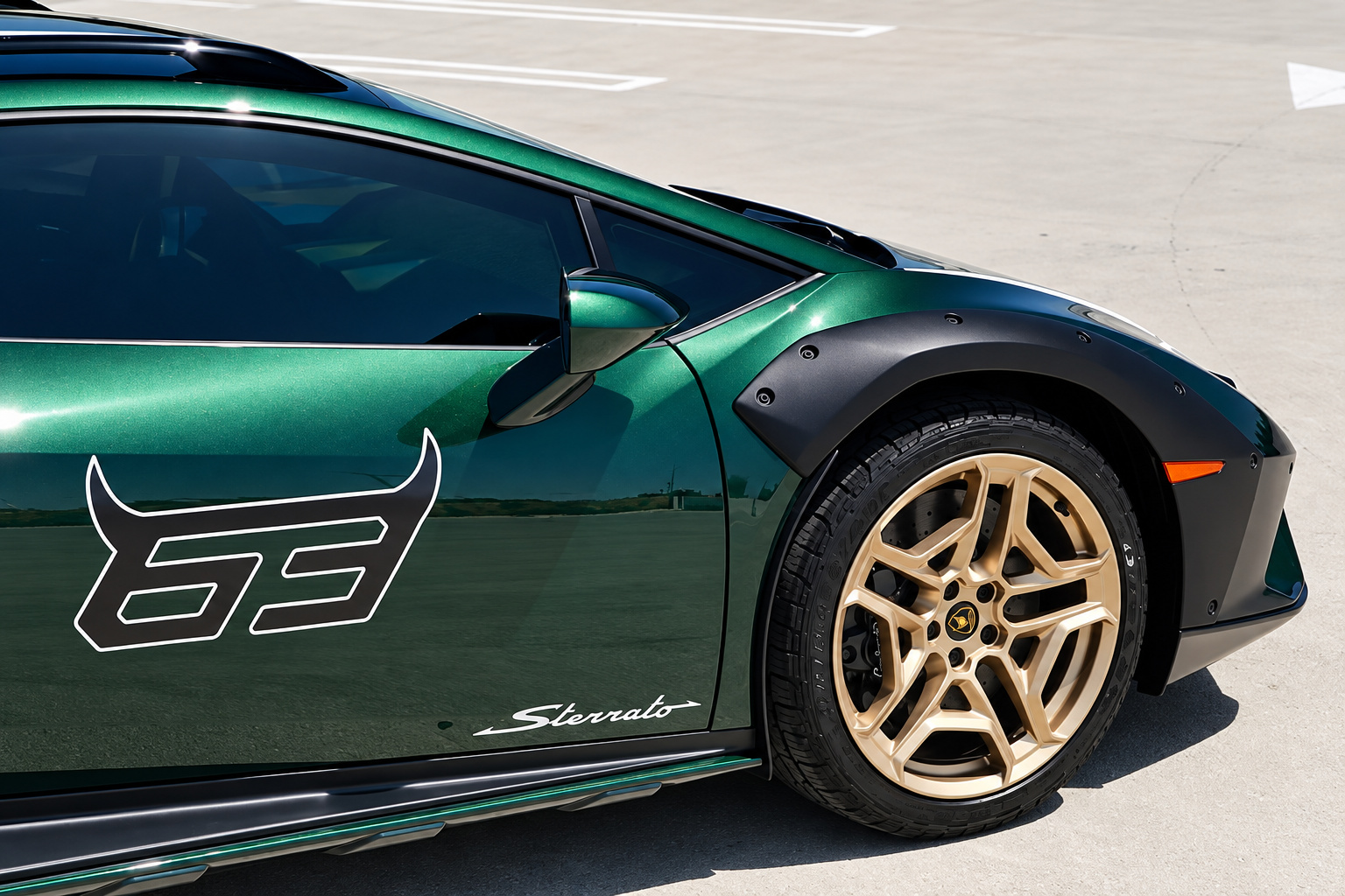 Door of the green Huracan Sterrato with the 63 decal and Sterrato script above the bronze front wheel