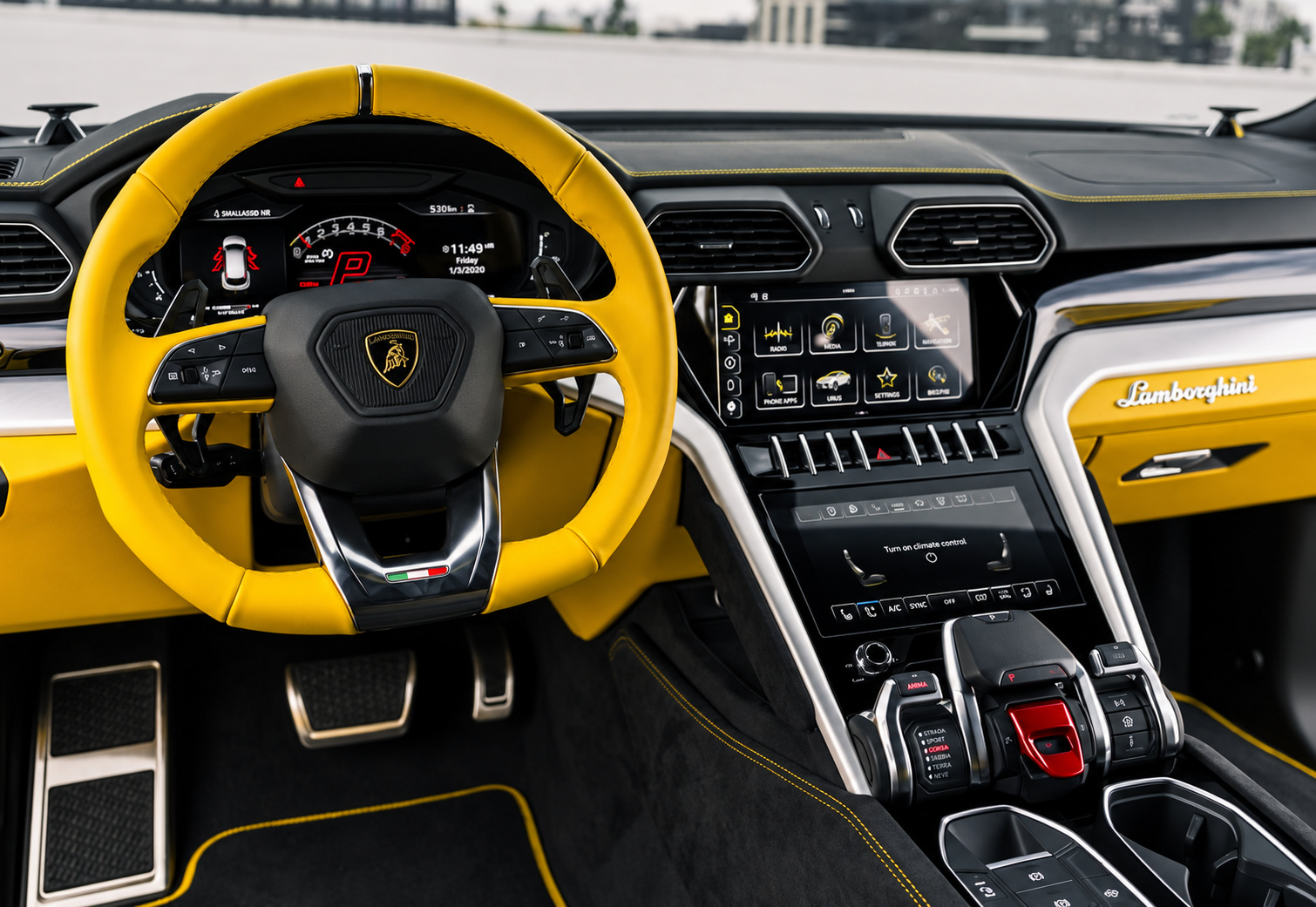 Steering wheel of the yellow Urus with yellow leather on the rim, yellow stitching and the stacked centre screens