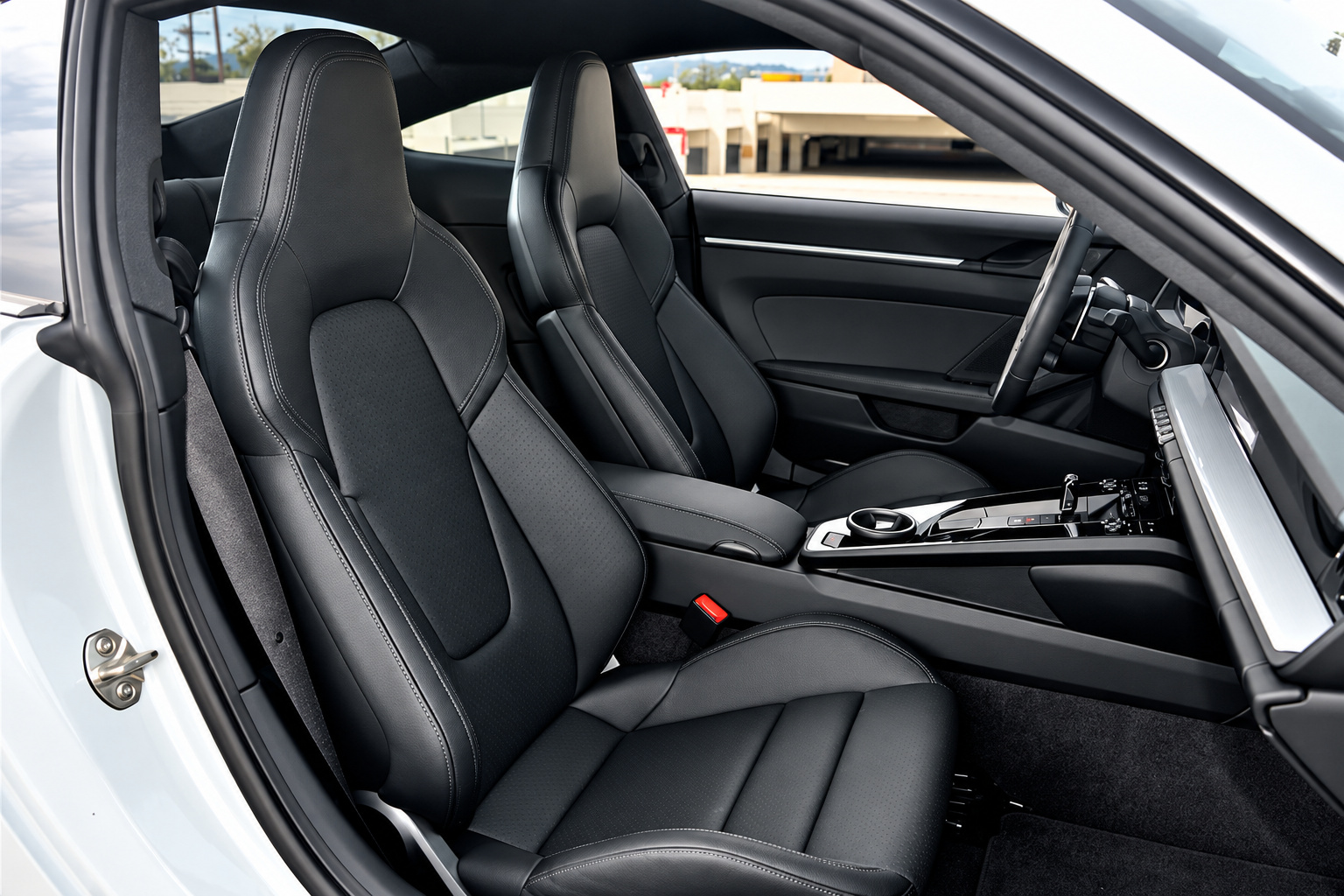 Black sport seats inside the Porsche 911 Carrera T with no rear seats behind them