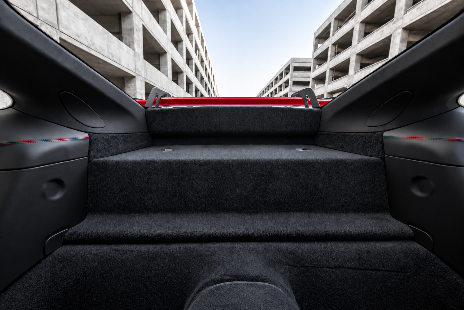 Carpeted rear shelf inside the Porsche 911 GT3 where the rear seats have been deleted