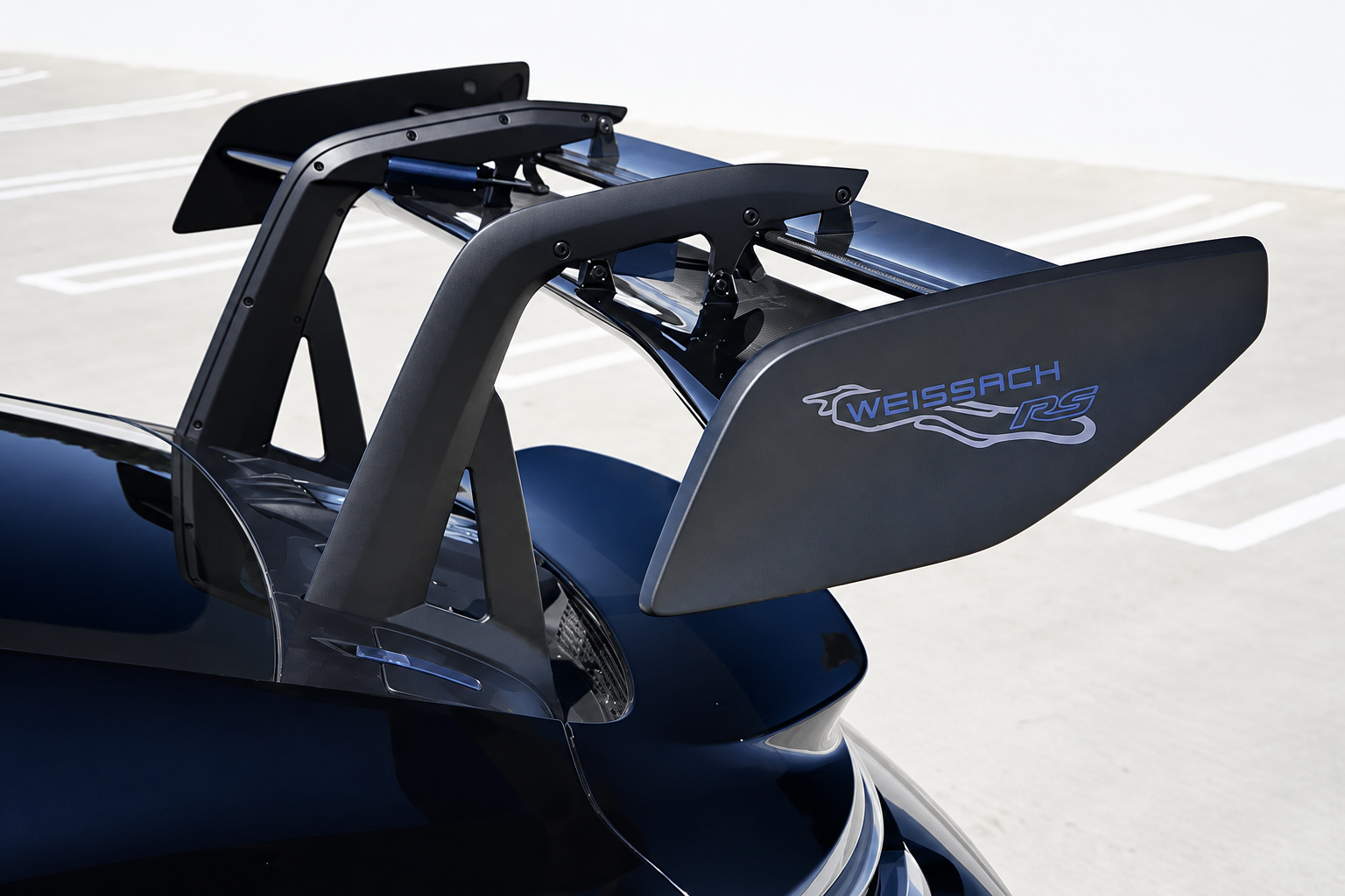 Weissach script on the end plate of the carbon rear wing of the black Porsche 911 GT3 RS