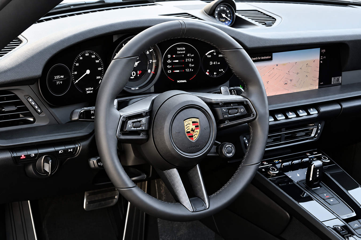 Driver view in the Porsche 911 Targa 4 GTS with the analogue tach and the mode dial on the steering wheel