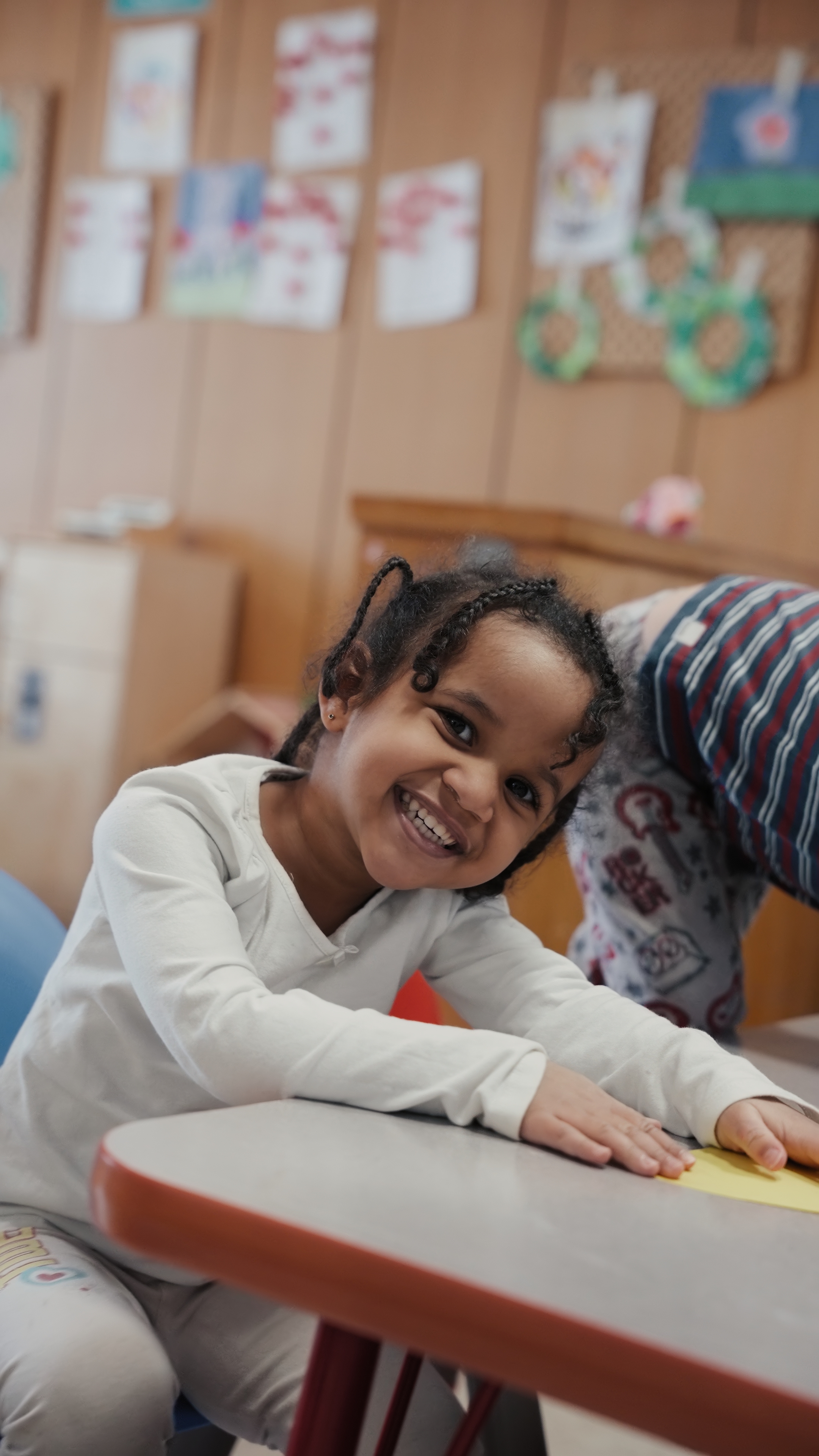 Smiling child at Tots 2 Kids Edmonton