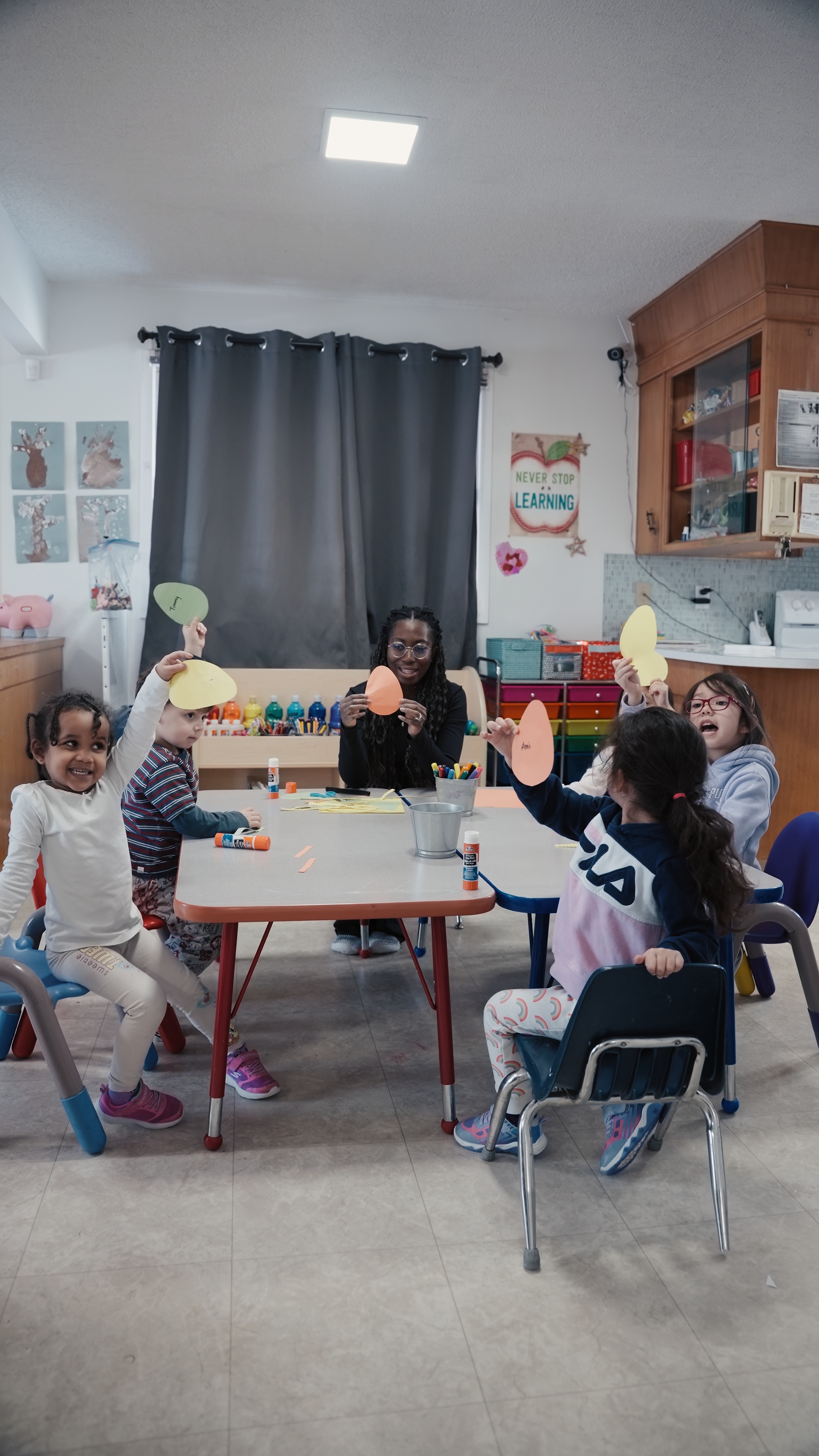 Group craft activity at Tots 2 Kids