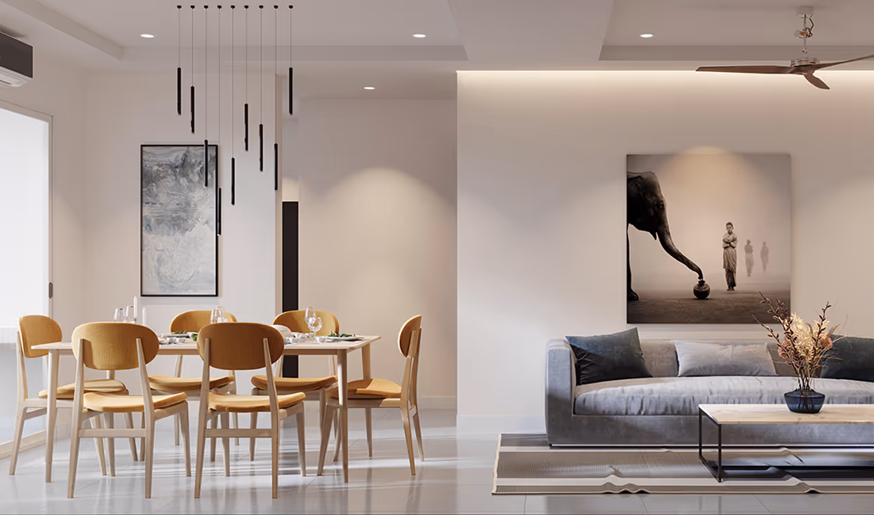 Modern dining and living room with wooden chairs around a table, gray sofa, coffee table with vase, and artwork featuring an elephant and people.