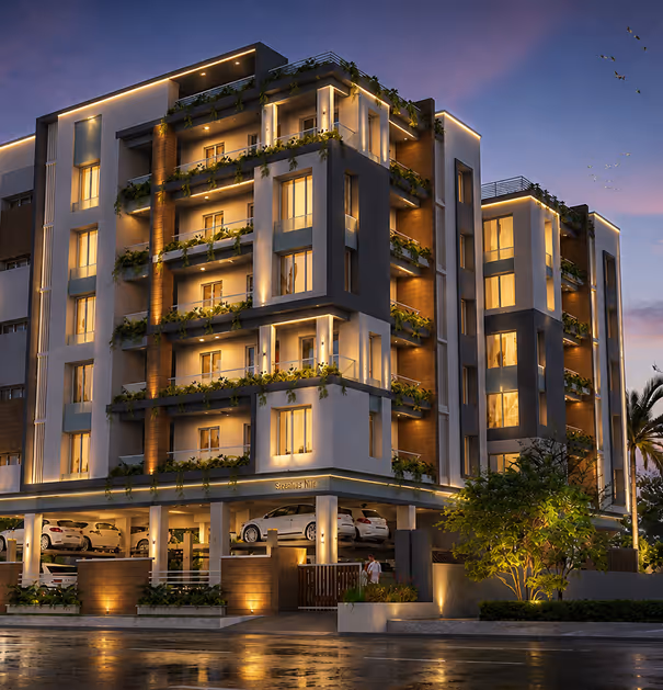 Modern five-story apartment building at dusk with exterior lighting and greenery on balconies.