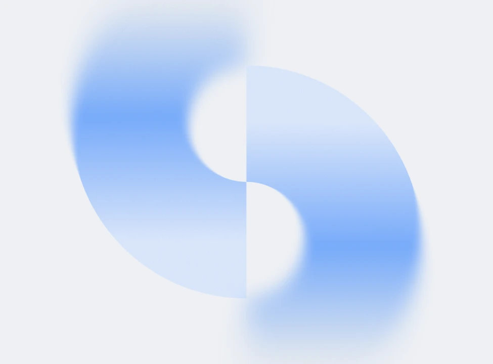 Abstract blurred blue and white yin-yang shape on a light background.