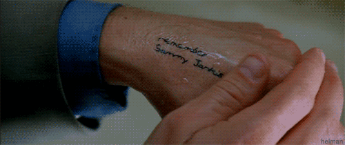 Leonard in Memento, illustrating the need for an external memory system.