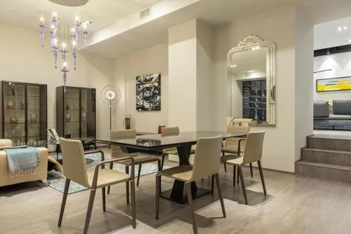 Dining room with glass table and beige chairs