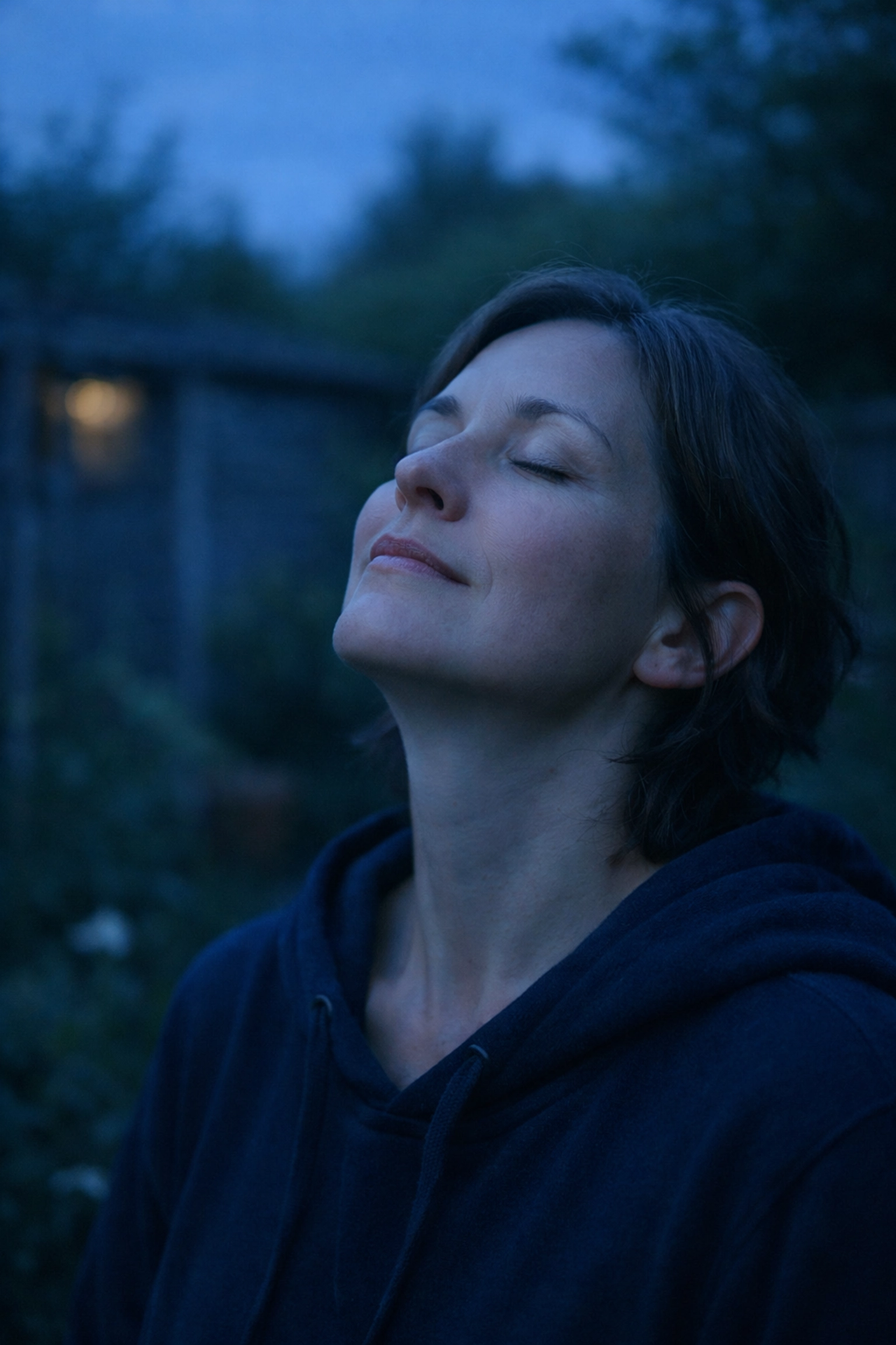 A parent taking a quiet moment for self-regulation to support their mental health and wellbeing as a carer.