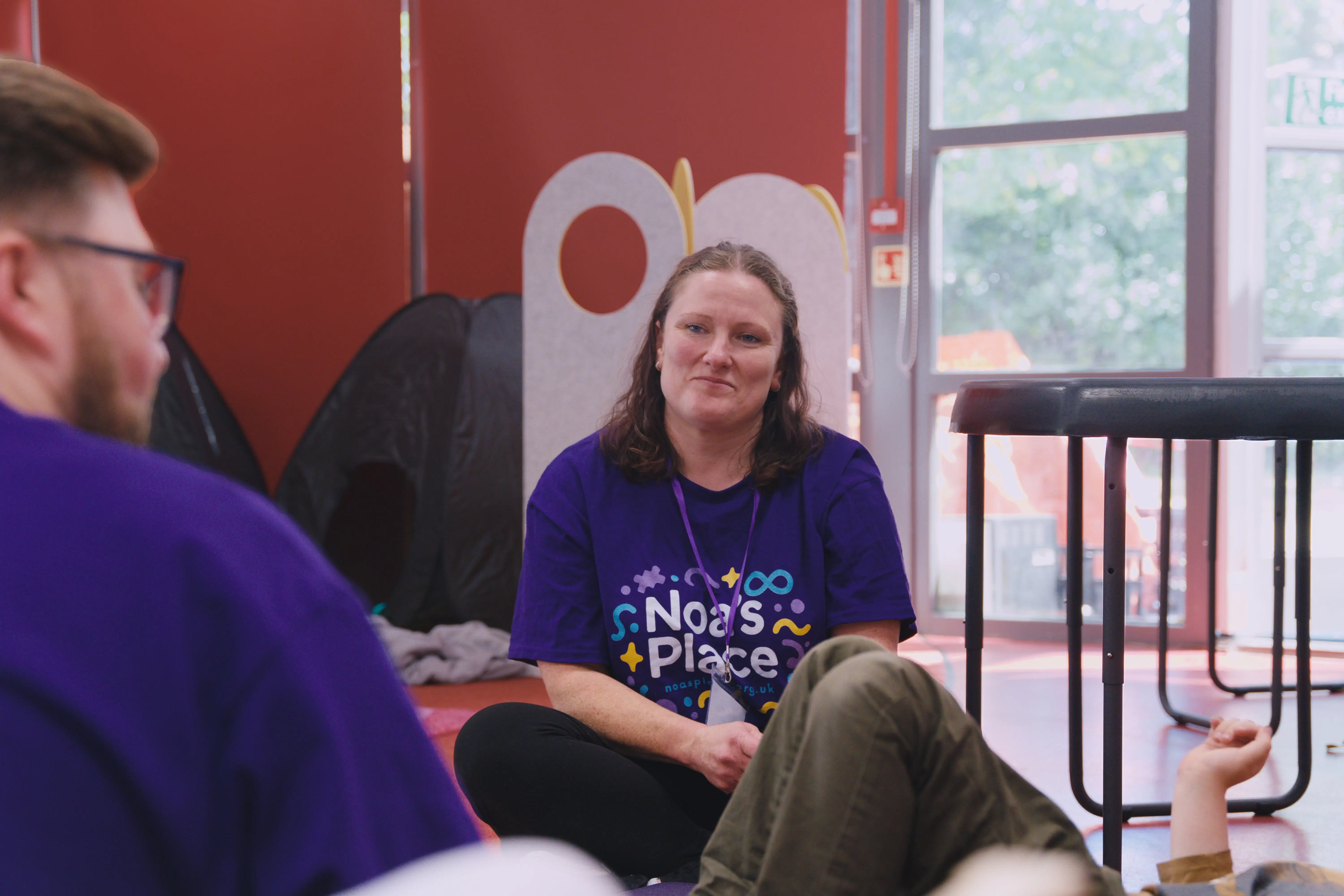 Team member engaging with a child in a calm space