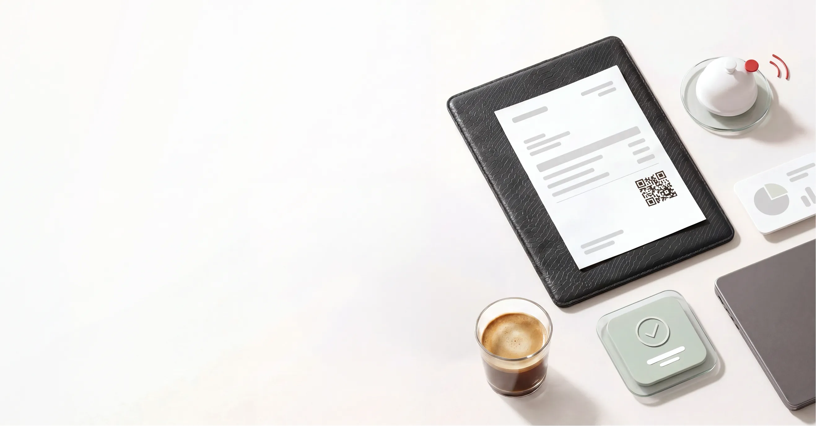 Invoice with QR code on black folder beside coffee, a tablet, and a small bell on a white desk.