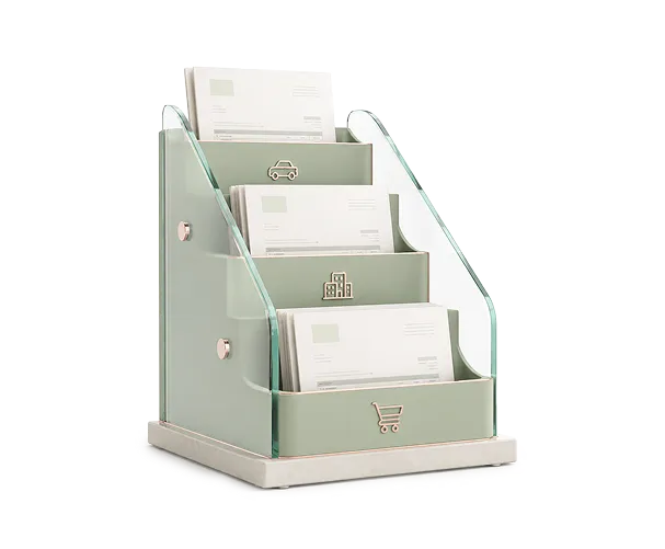 Three-tiered desktop organizer holding white envelopes or documents.