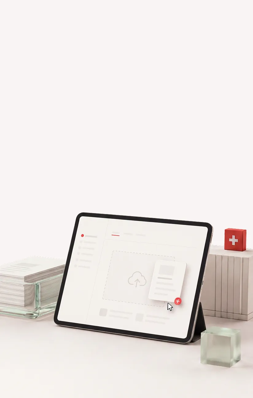 Tablet showing upload icon and document being added, with stacks of books and paper nearby on a desk.