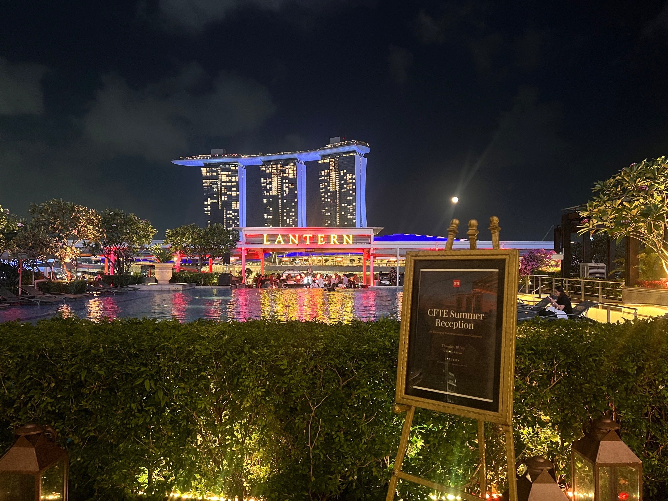 Lantern signage and the CFTE Summer Reception board, Marina Bay Sands behind