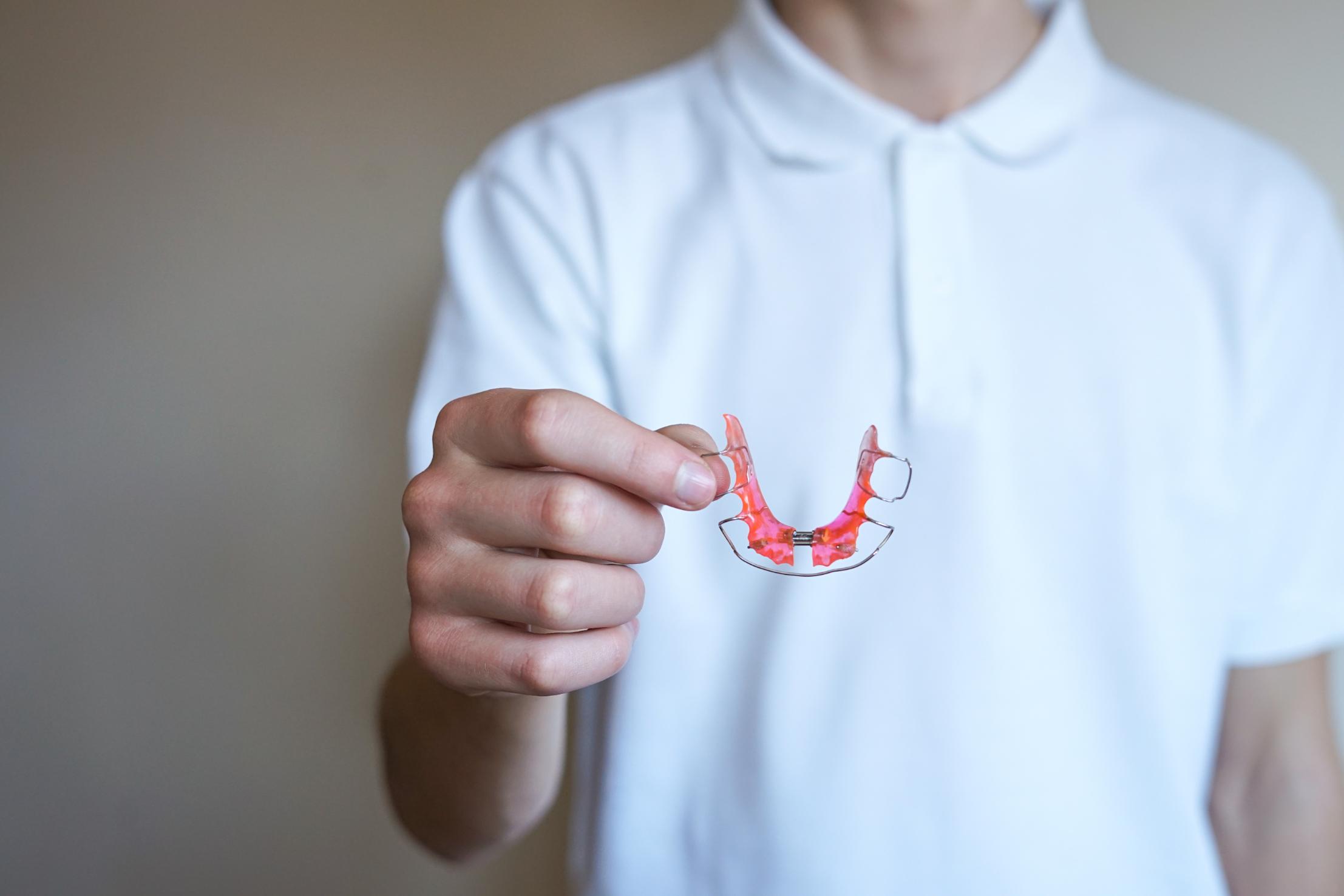 Clinician holding a removable orthodontic expander appliance