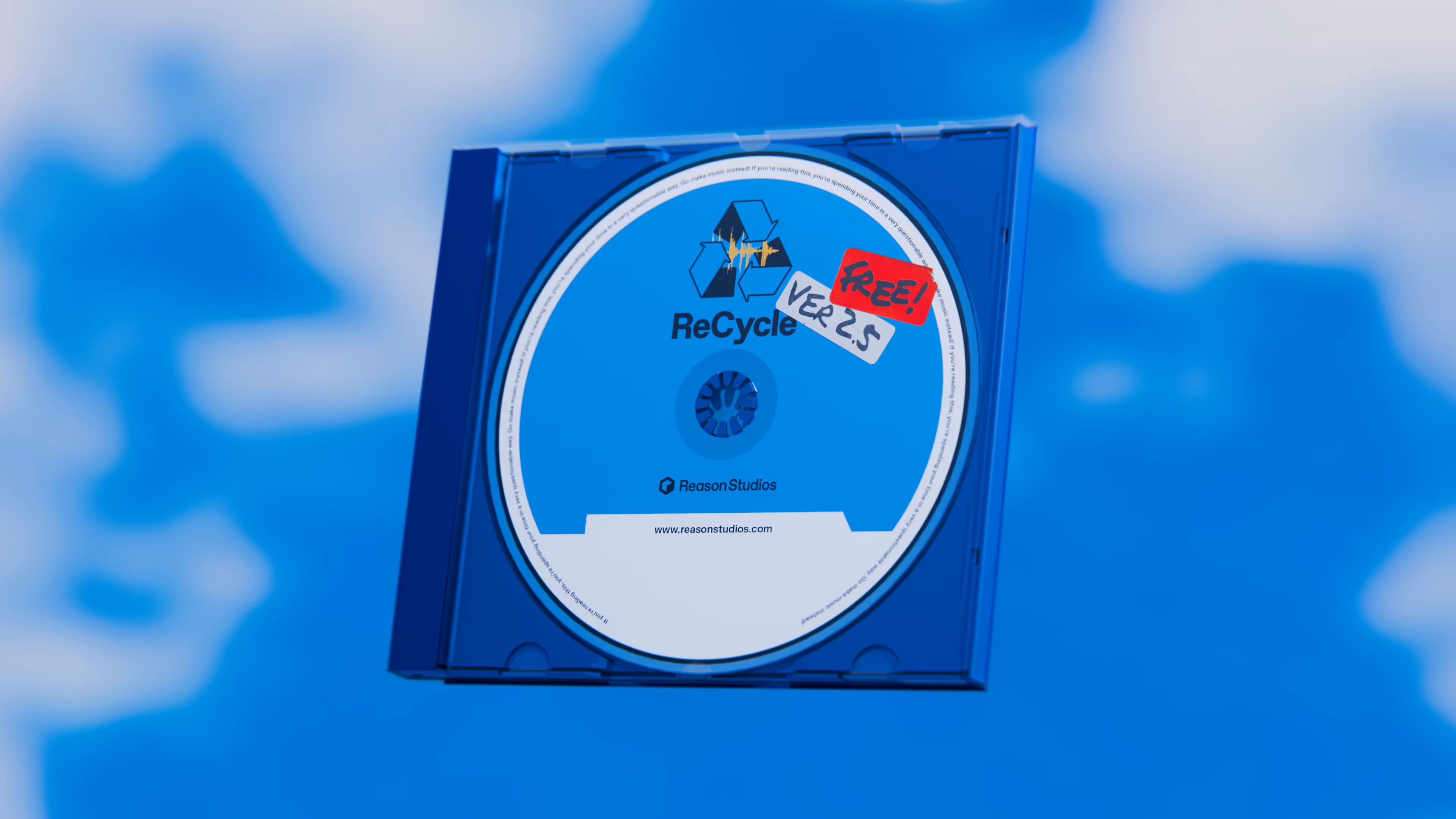 Blue CD case with a ReCycle software disc labeled FREE! VER 2.5 against a blue sky background.