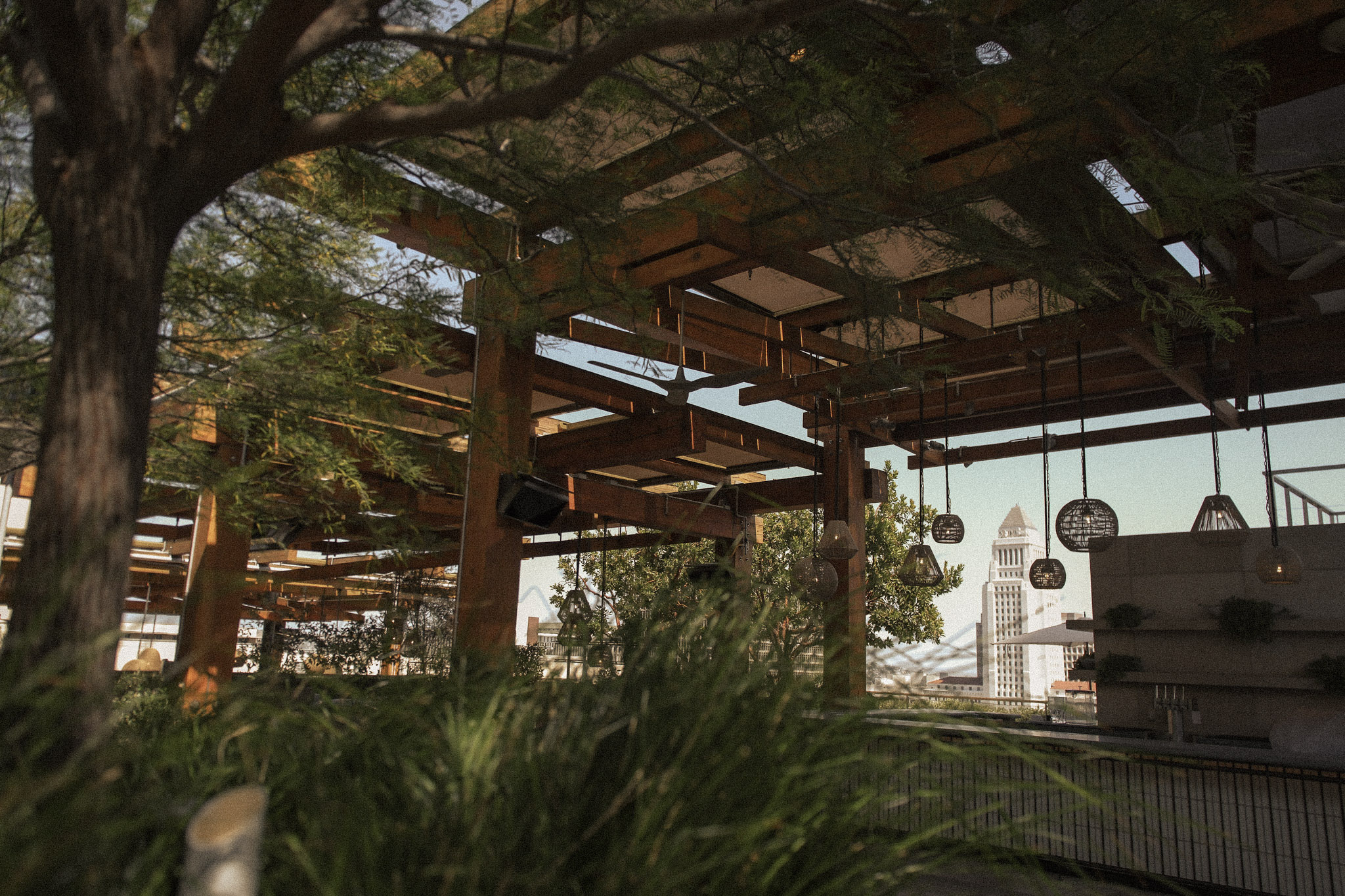 The Conrad Los Angeles patio LA city view- Wellness Hotel feature by Well City Guide