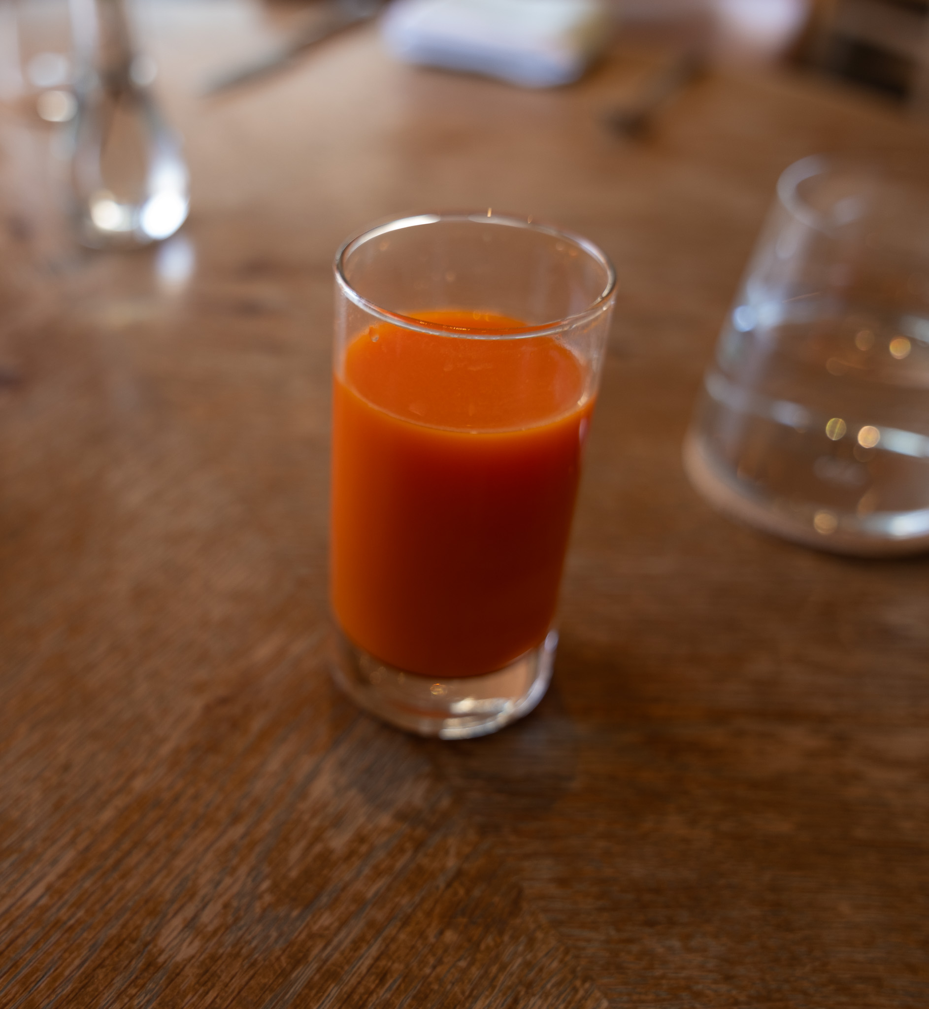 San Laurel spirit-free drinks card listing Botanical Blends and Rejuvenating Tonics, including the Valenciano with carrot, orange and saffron