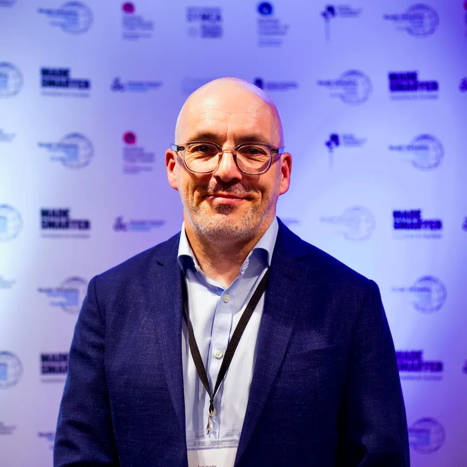 Andy Procter, Auditel Associate Partner, in a navy jacket at a business event