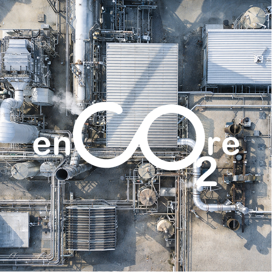 Encore CO2 logo on top of a top-down view of a factory from the outside.