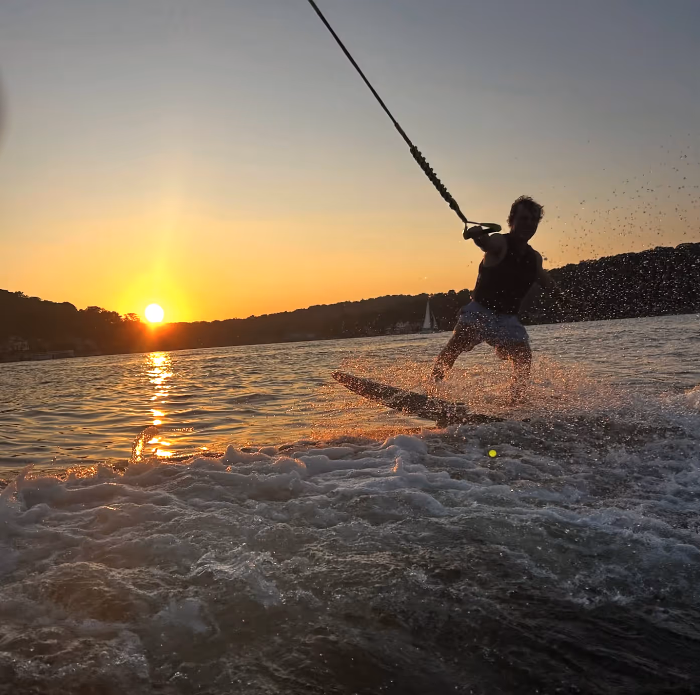 An adult wakesurfing and wakeboarding in Miami