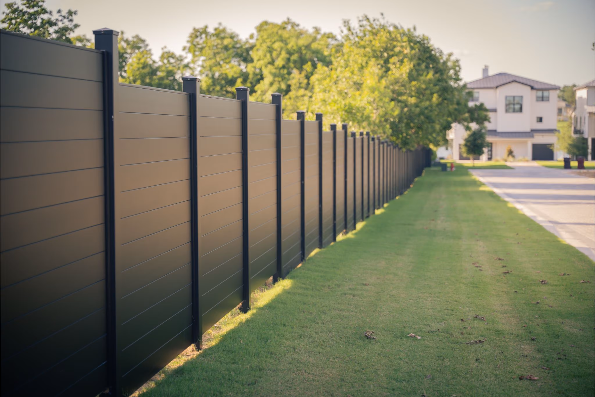 Fireproof fence panels made from solid aluminum used near a modern home in a wildfire-prone region.