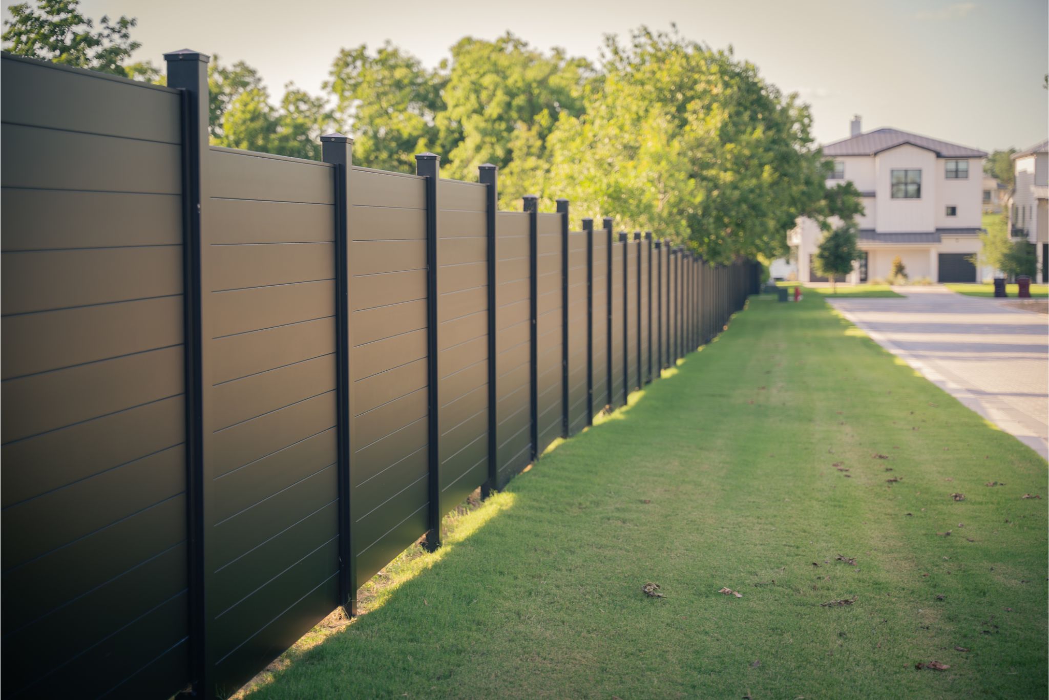 Fireproof fence panels made from solid aluminum used near a modern home in a wildfire-prone region.